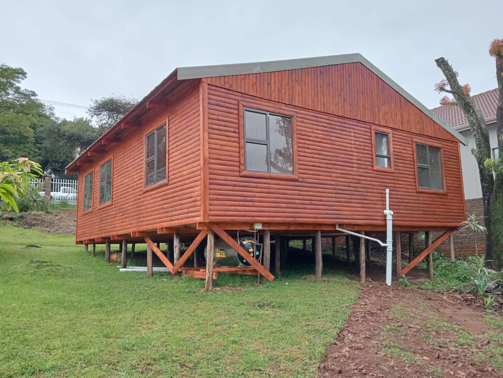 Large raised wooden Wendy house