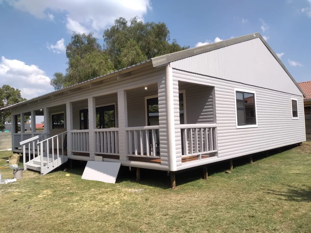 Wooden log-pine Wendy house with veranda