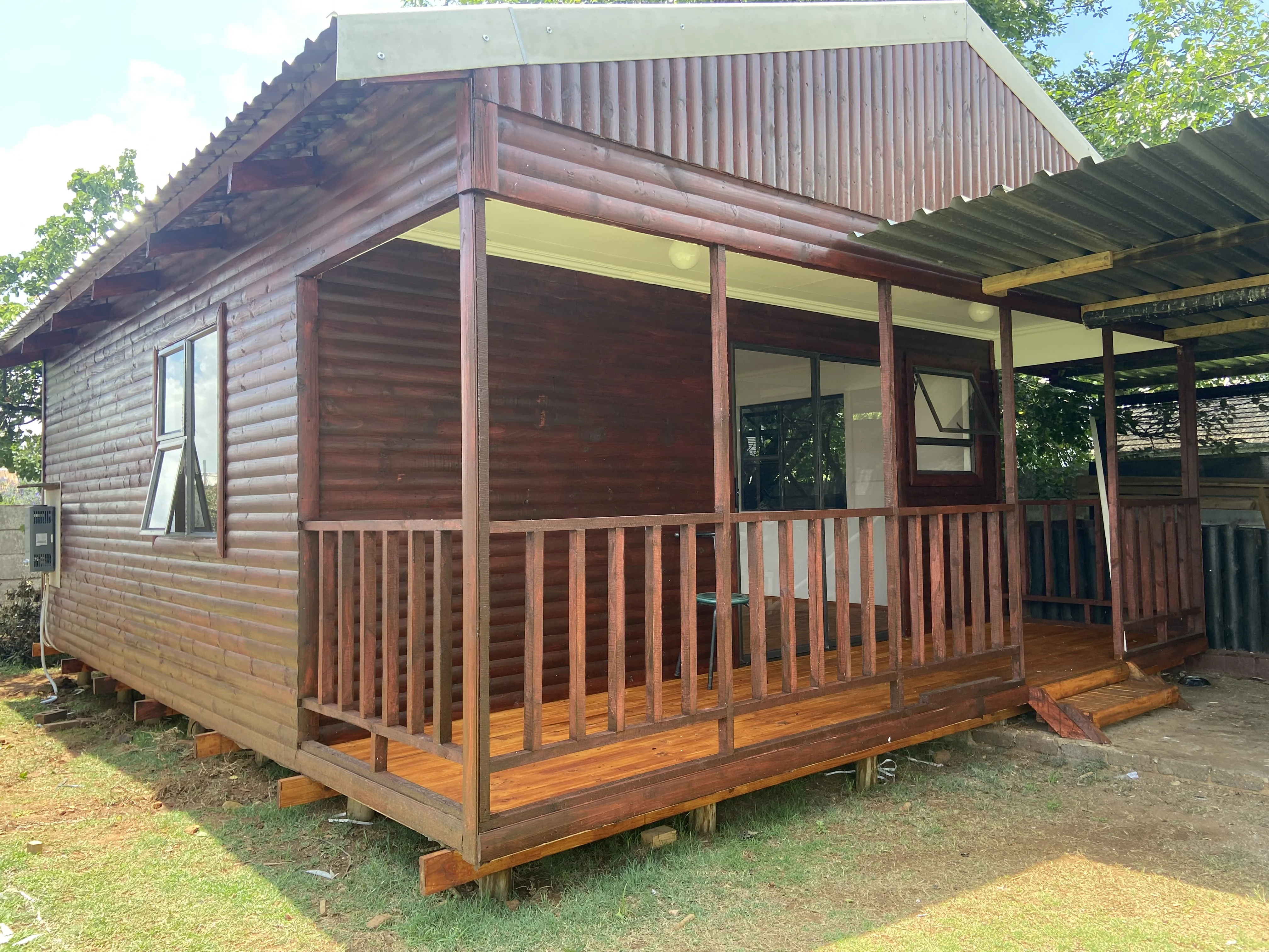 Wooden Wendy house office with veranda