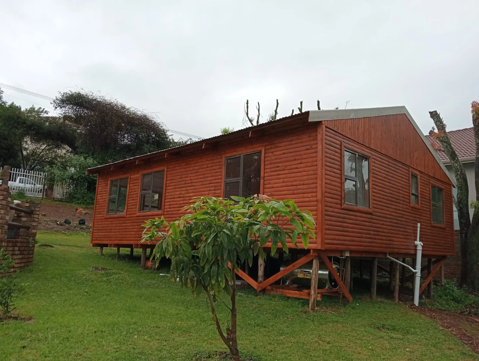Raised wooden Wendy house room unit